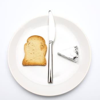 Close up of rusk bread slice, cheese and knife