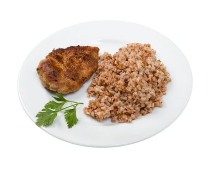 chops with buckwheat on plate.isolated on white background