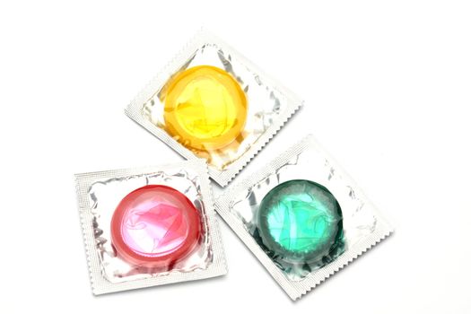 Colored condoms pack  on  white