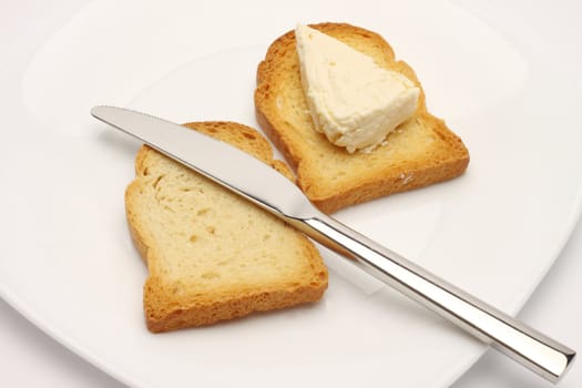 Close up of rusk bread slice, cheese and knife