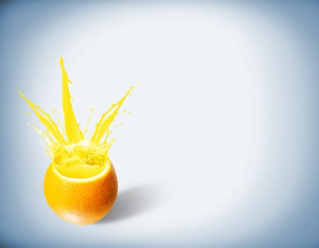 ice cubes fall into the orange, spray and splashes of juice