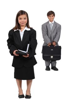 Children dressed as business people