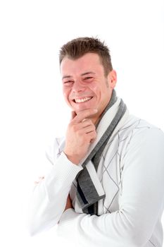 Candid image of a handsome young man with a broad grin enjoying a good laugh isolated on white