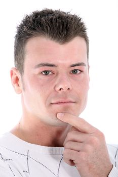 Handsome serious pensive man with a modern spiky hairstyle looking at the camera with his finger on his chin, closeup studio portrait isolated on white