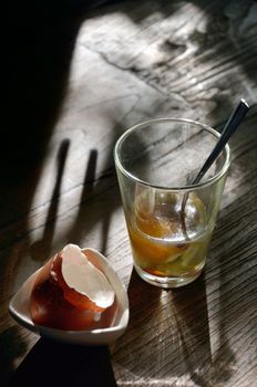 Soft-boiled egg in retro clear glass with morning light 