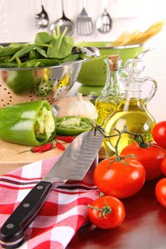 Fresh tomatoes and green peppers on counter