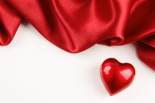 Valentine heart with red silk on white background