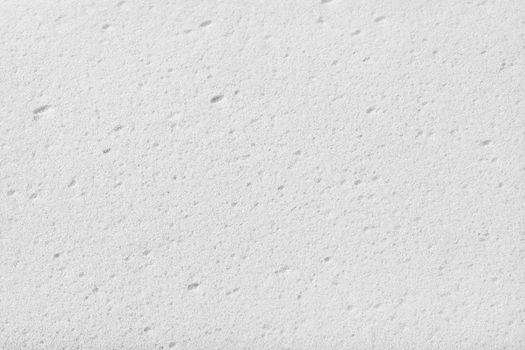 White cleaning sponge texture. Close up. Top view