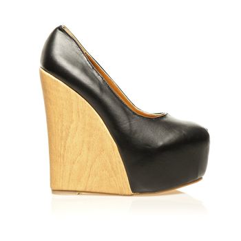 High Heels with extreme platform sole in wedge style. 