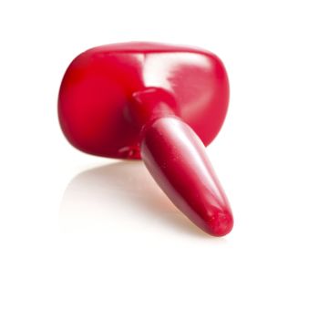 A red sex toy (anal plug) made of rubber/latex, isolated on white. Shallow DOF. 