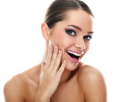 Young beautiful latino woman surprised over white background