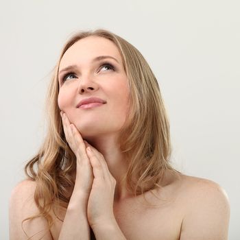 Young natural woman with clear face isolated over white background