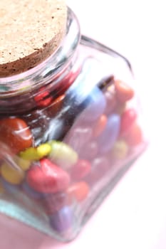 colorful chocolate drops in a glass beverage