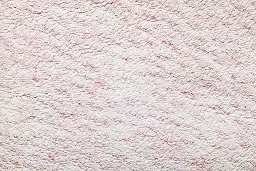Light pink leather texture for background . Macro shot