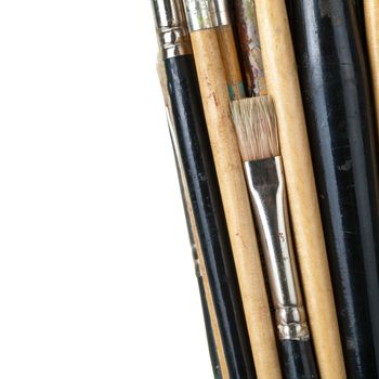 Paint brushes isolated on white background, macro shot with empty room for text