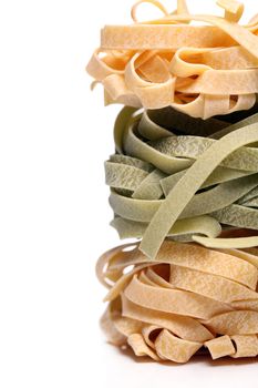 Fresh and tasty tagliatelli isolated over white background