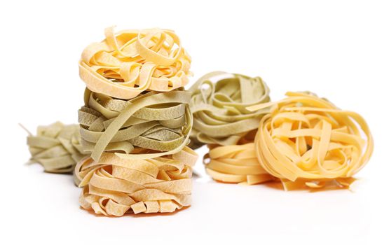 Fresh and tasty tagliatelli isolated over white background