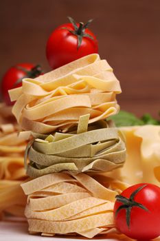 Fresh ingredients for pasta isolated on wooden background