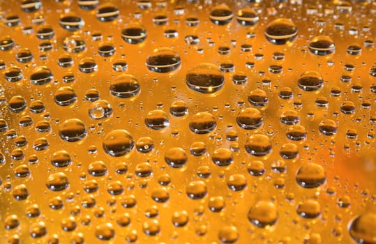 yellow water droplets background .close up of water drops