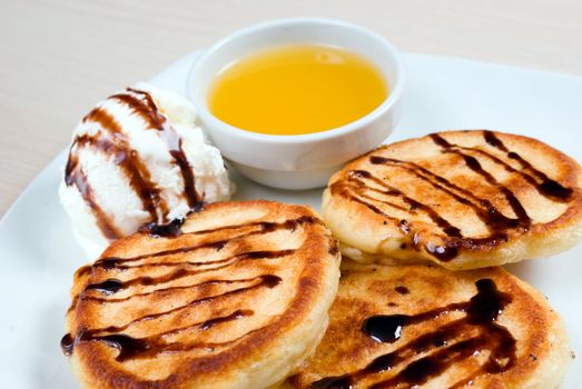 morning meal.pancakes with icecream and honey