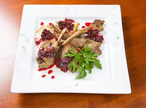 meat lamb on rib with cowberries by sauce .Italian kitchen