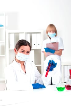 group of scientists working in laboratories with equipment