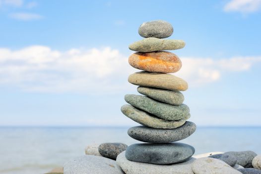 Pile of the pebble on the sea boulders