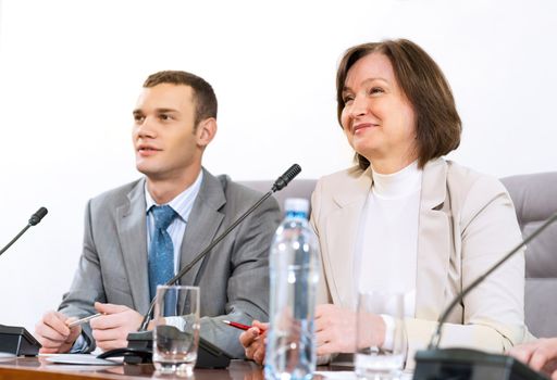 businessmen sitting in a chair at the table, communicate at the conference