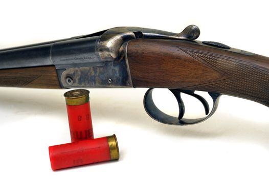 shotgun and its cartridges. Still life representing hunting.
