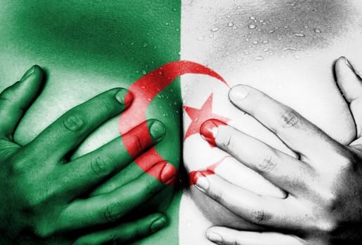 Sweaty upper part of female body, hands covering breasts, flag of Algeria