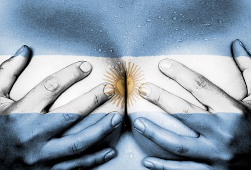 Sweaty upper part of female body, hands covering breasts, flag of Argentina