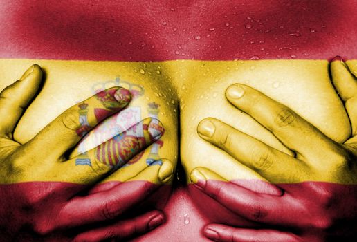 Sweaty upper part of female body, hands covering breasts, flag of Spain