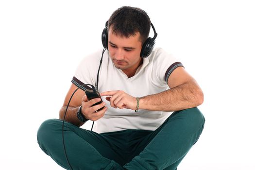 Young handsome man with headphones isolated over white background