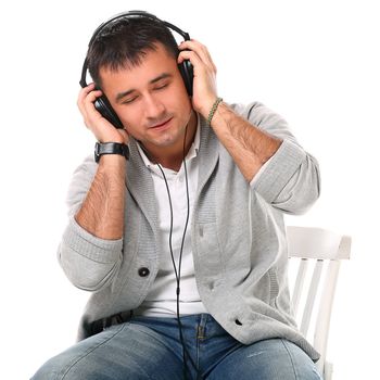 Young handsome man with headphones isolated over white background