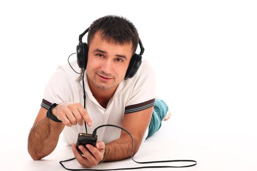 Young handsome man with headphones isolated over white background
