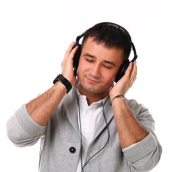 Young handsome man with headphones isolated over white background