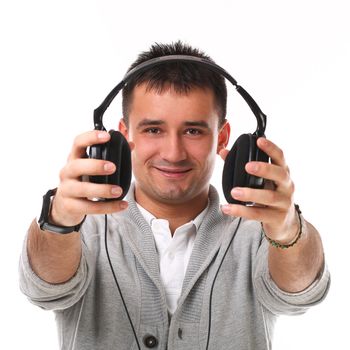 Young handsome man with headphones isolated over white background