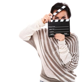 Young happy woman holding a clapboard isolated over white background