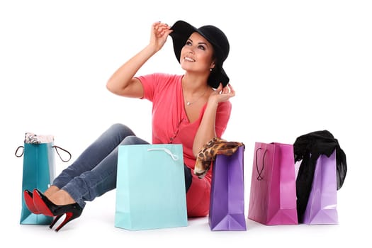 Young happy woman enjoys shopping isolated over white background