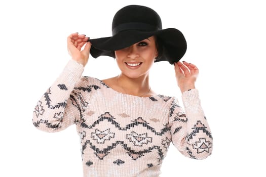 Young beautiful woman in hat and dress isolated over white background