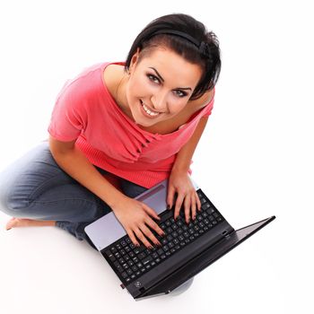 Young happy woman with laptop isolated over white background