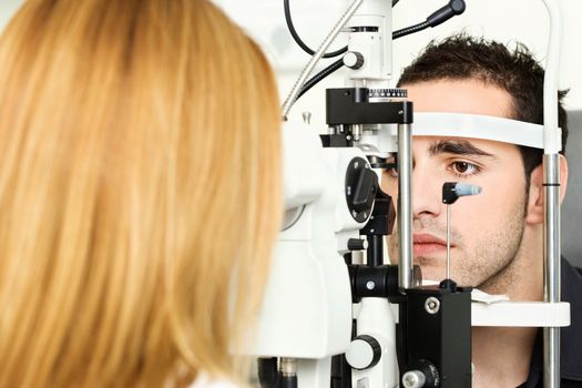 Male patient is having a medical attendance at the optometrist