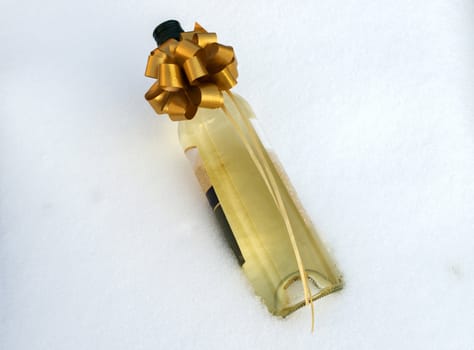 bottle white wine in the snow