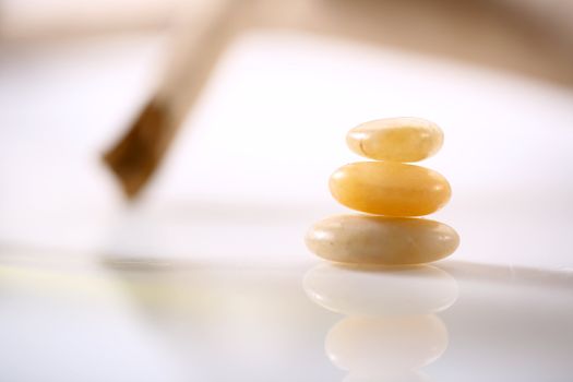 Three gold stones on white background