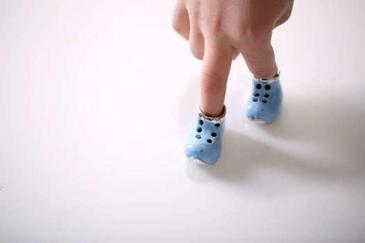 Small shoes on the white background