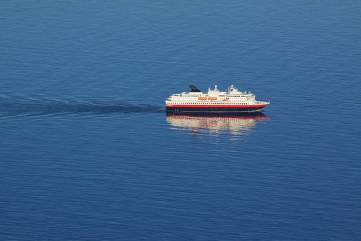 Aerial view of traditional norwegian cruise ship in tranquil blue ocean