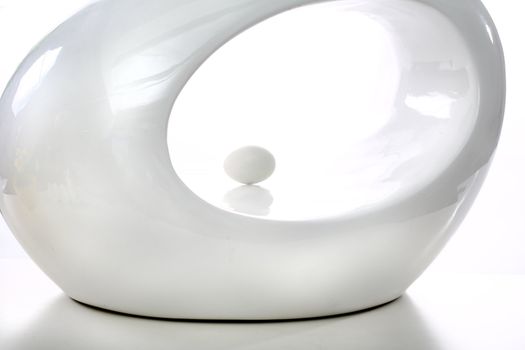 White oval shape on white background