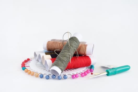 sewing accessories with pins, needle and thread