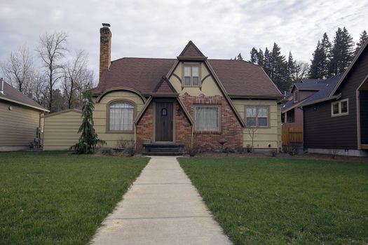 Little Old Bungalow House with Path Along Front Lawn