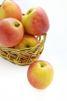 Apples in basket isolated on a white background